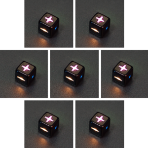 Collage of 7 lit Onyx Black Fudge D6 with a rainbow of colors across each face. Onyx Black colorway is a fully opaque black with no glitter, creating an almost matte style. The numbers or symbols are pale white.