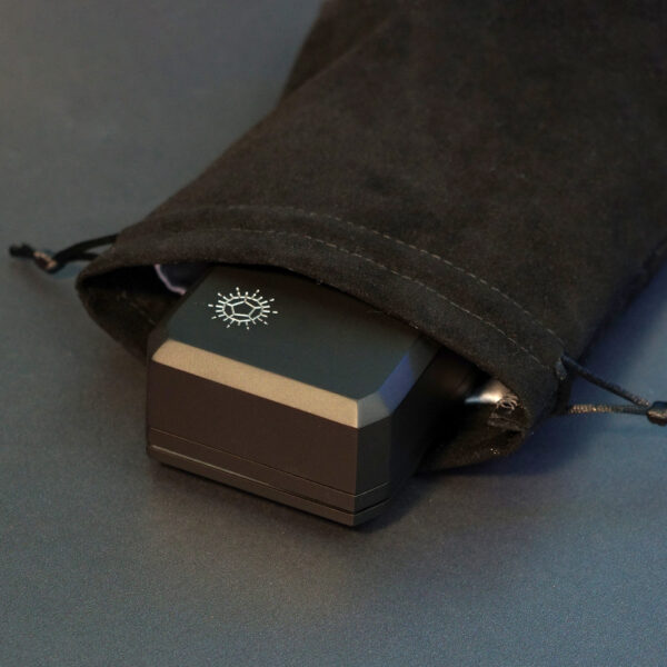 Rectangle shaped black velvet drawstring bag with a Large Charging Case inside.
